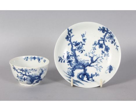 A GOOD WORCESTER 18TH CENTURY TEA BOWL AND SAUCER, painted with the Root pattern in blue and white, workman's marks.