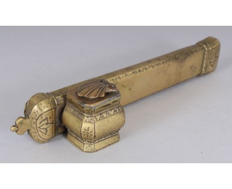 A 19TH CENTURY ISLAMIC BRASS TRAVELLING PEN CASE WITH INKWELL, the top with a small seal mark, 7.5in long.