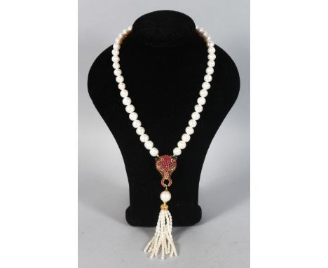 A SILVER, GOLD PLATED AND PEARL PANTHER HEAD NECKLACE, set with rubies and emeralds.