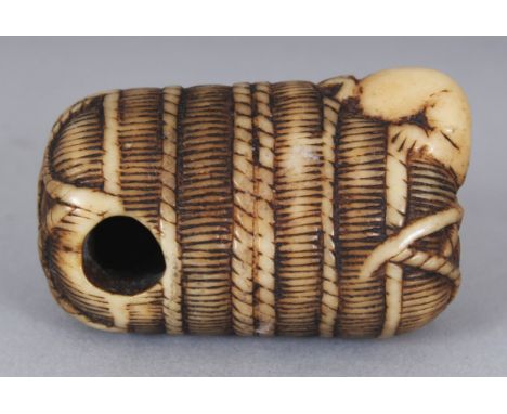 A GOOD QUALITY JAPANESE MEIJI PERIOD STAINED IVORY NETSUKE OF RAT BURROWING INTO A STRAW BALE, 1.5in wide & 1in high.