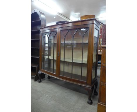 An early 20th Century mahogany bow front display cabinet 