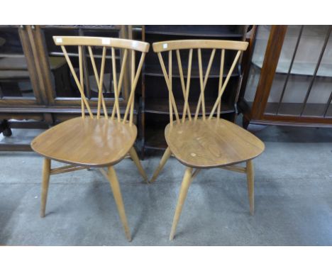 A pair of Ercol Blonde elm and beech 376 model candlestick chairs 