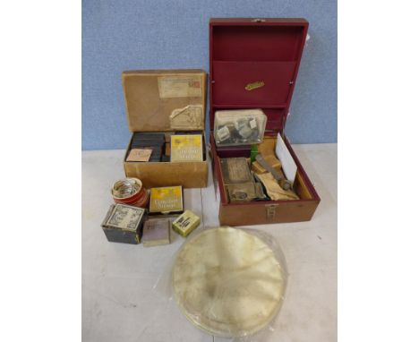 One case of banjo accessories including strings, skin and pegs and one box of assorted gramophone and record player parts 