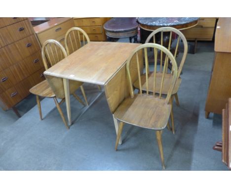 An Ercol Blonde elm and beech Windsor drop-leaf table and four chairs 