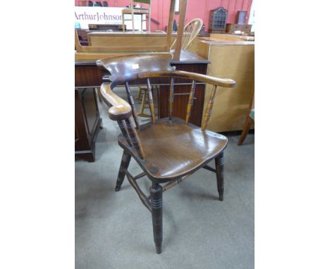 A Victorian elm and beech smokers bow chair 