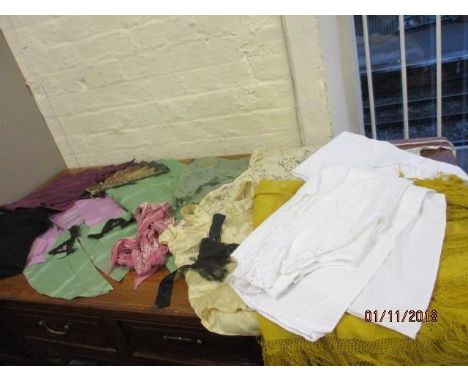 A vintage boys silk suit in green and lilac, a fan, scarves, a yellow gypsy shawl with tassels, vintage cotton undergarments,