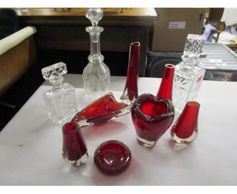 A group of Whitefriars and Bohemian ruby glass vases and bowls and three cut glass decanters 