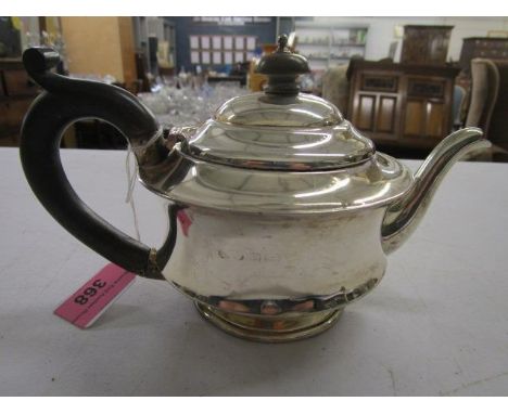 A silver teapot with ebony handle and finial, Birmingham 1920 or 1945, total weight 302.55g 