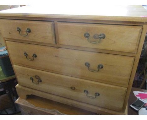 A modern pine chest having two short and two long drawers standing on bracket feet 30" H x 36"W 