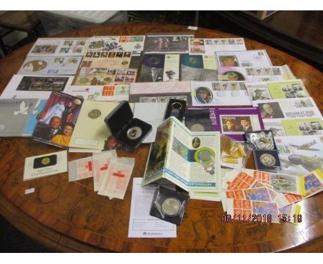 A quantity of coins and first day covers to include a silver Concorde £5 coin (925 Silver, 28.28g), a battle of Britain £5 co