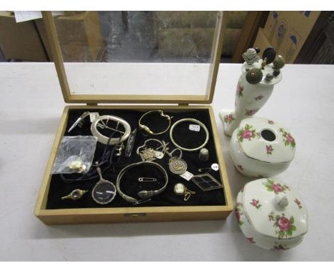 A selection of jewellery and dressing table items to include a white metal framed magnifying lens, an enamelled football badg