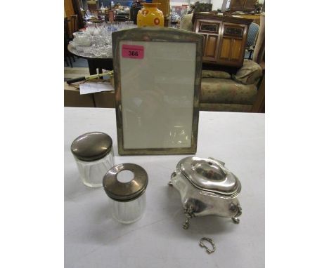 Silver to include a dressing table trinket box on four cast legs with animal paw feet and ring handle A/F, a photograph frame