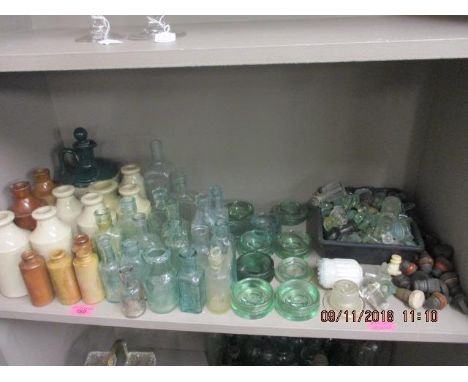 A Churtons Scotch Whisky stone decanter and a selection of small stone bottles, green glass medicine bottles and miscellaneou