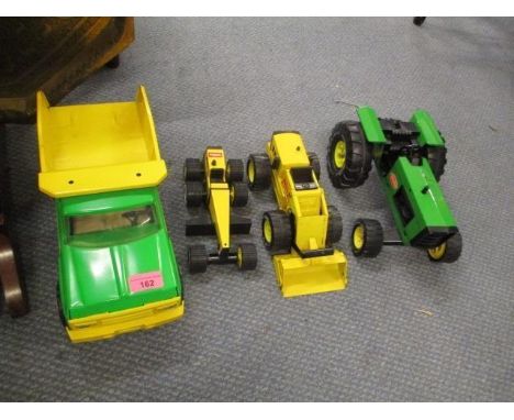 Four Tonka toys to include a tractor and a truck 