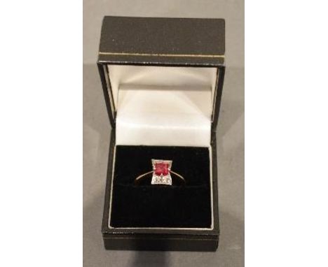 A 15ct. Gold and Diamond Set Ring with a Square Stone surrounded by Diamonds within a Pierced Setting 