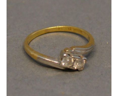 An 18 Carat Gold and Platinum Diamond Crossover Ring 