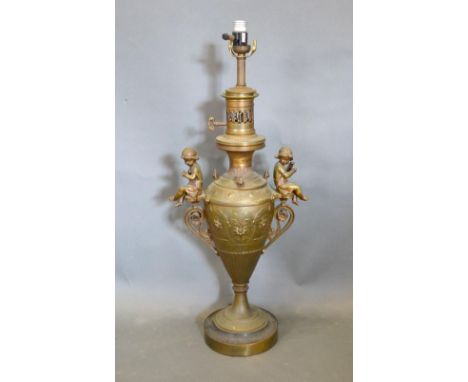 A 19th Century Table Lamp of Urn Form mounted with Putti upon a Circular Pedestal Base, 60 cms tall 