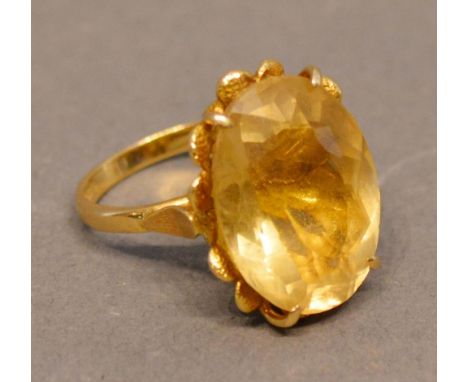 An 18 Carat Gold Dress Ring set large oval citrine 