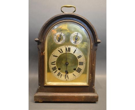 A Late Victorian, Early Edwardian Oak Dome Shaped Mantle Clock with brass carrying handle, the brass dial silvered chapter ri