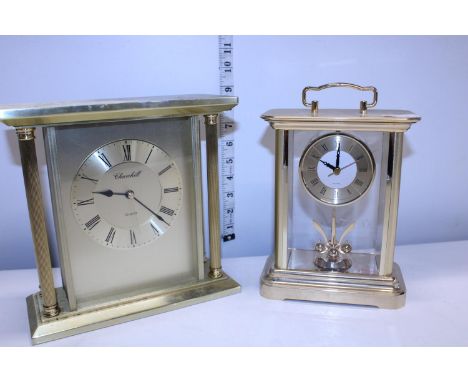 A heavy Churchill brass carriage clock and one other in working order 