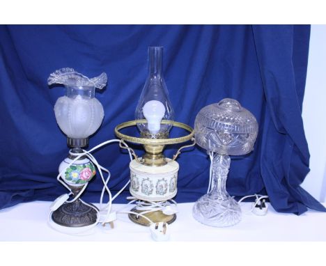 Three assorted table lamps including a glass style hurricane lamp, shipping unavailable 