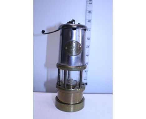 A vintage miniature brass and steel miners lamp 