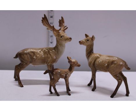 A family of three Beswick deer 