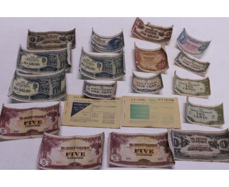 A job lot of WW2 Japanese issue military bank notes and two vintage ration books 