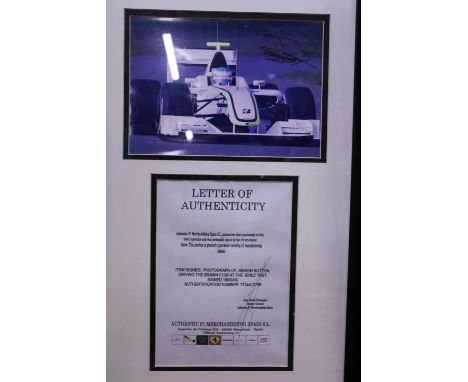 A framed hand signed photograph of Jenson Button dated 2009 with COA 