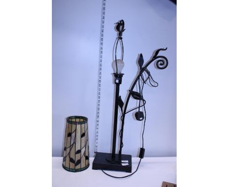 A unusual metal based table lamp with Tiffany style shade, shipping unavailable 