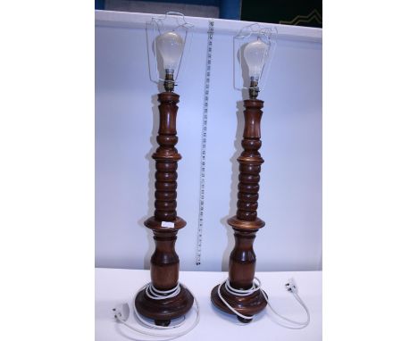 A pair of large wooden lamp bases, shipping unavailable 