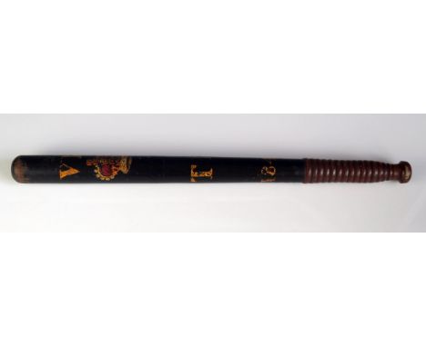 A Victorian polychrome wood truncheon, with Royal Cypher, initialed TM dated 1848, with ring turned handle, 46cm long. 