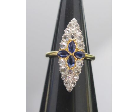 A Sapphire and Rose Cut Diamond Marquis Ring in a high carat precious yellow metal setting, size K.75, KEE tests as 18CT, 4.6