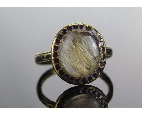 A Georgian Precious Yellow Metal, Garnet and Enamel Memorial Ring, inscribed SARAH BOWEN OB JAN 1773 AE 77, 15X13.7mm head, s