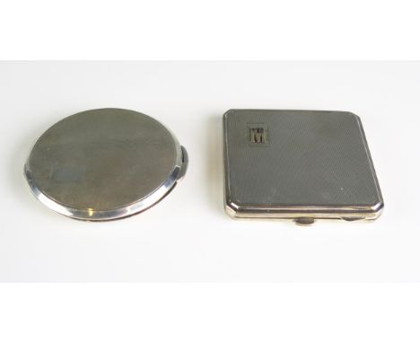 A circular silver powder compact, together with a square example, initialled, (2). 