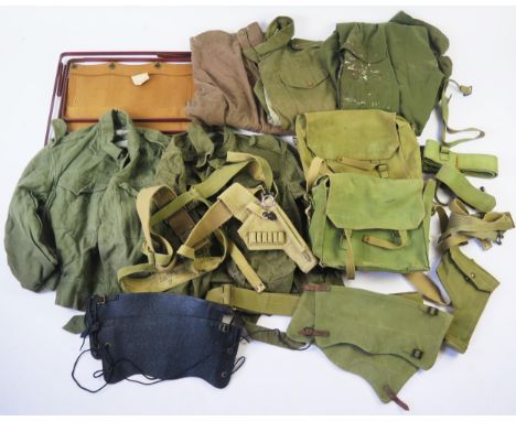 A collection of British army canvas webbing, holster, belts, gaiters, denim blouses, folding canvas chair, etc 