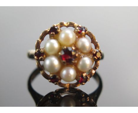 A 9ct Rose Gold, Garnet and Cultured Pearl Cluster Ring, 14.6mm head, size K, stamped 9CT, 3.95g 