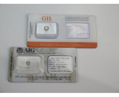 Two Certificated Fancy Colour Diamonds in blister packs with gemological reports: GIL .75ct intense greenish yellow and AIG .