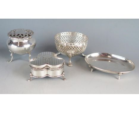 A mixed collection of silver various makers and dates includes a trefoil-shaped ring box on swept feet, 6.5cm wide, an oval p