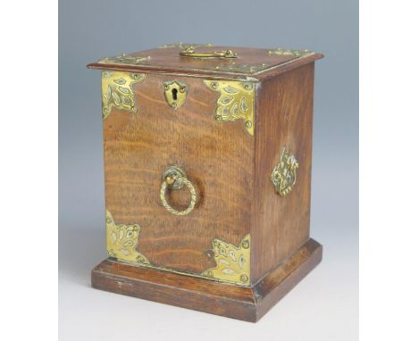 A late Victorian oak and brass bound tea caddy in the form of a coal purdonium, with hinged fall front and galvanised liner, 