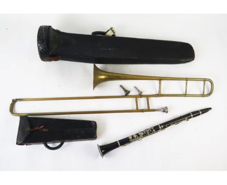A Glaccroix Superior G F clarinet, contained in a stitched leather case, a brass trombone with spare mouthpieces, in fitted c