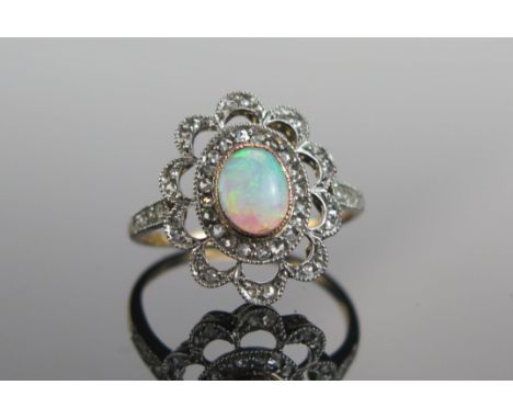 An 18ct Gold, Opal and Old Cut Diamond Ring, 7.2x5.6mm principal stone, 18.25x15.25mm head, size N.5, stamped 18CT, 3.36g 