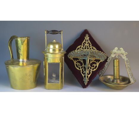 A brass hand held lamp with turned wooden handle, trench art table lighter, wall bracket etc. 