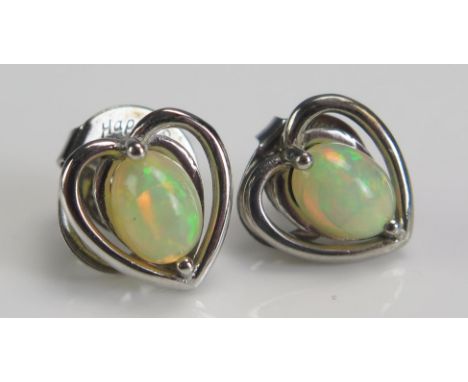 A Pair of Silver and Opal Heart Shaped Studs 