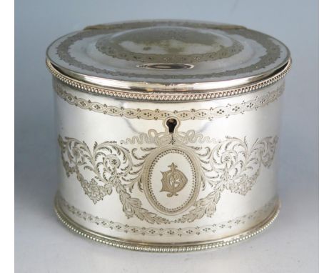 A silver plated oval tea caddy by Elkington &amp; Co, crested and initialled, with chased foliate decoration, 12cm wide. 