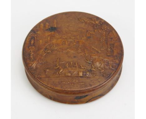 A 19th century pressed maple snuff box, of circular form the lid decorated with a riverside village scene, with tortoiseshell