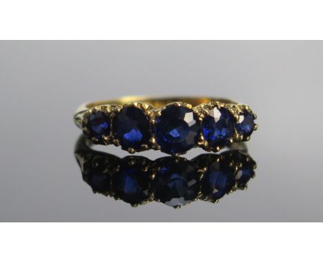 An Antique 18ct Gold And Natural Sapphire Five Stone Ring, c. 5.3mm principal stone, size M.5, London 1907, 2.86g 