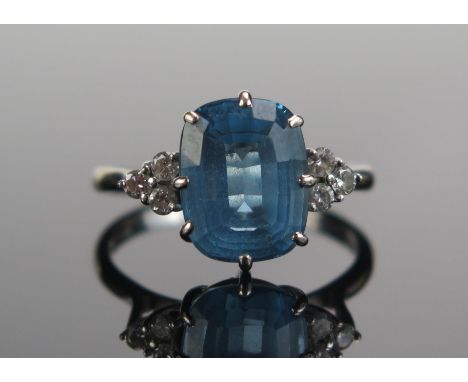 An 18ct White Gold, Blue Topaz????? and Diamond Ring, 11.3x9mm principal stone, size S, hallmarked, maker C&amp;F, 5.18g 