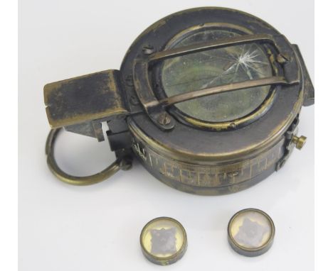 A World War II British army issue Mk III hand held compass, dated 1942, together with two RAF evasion compasses. 