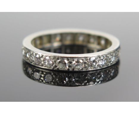 A Diamond Eternity Ring in a precious white metal setting, c. 3.2mm wide, size M.5, probably 18ct, 3.74g 